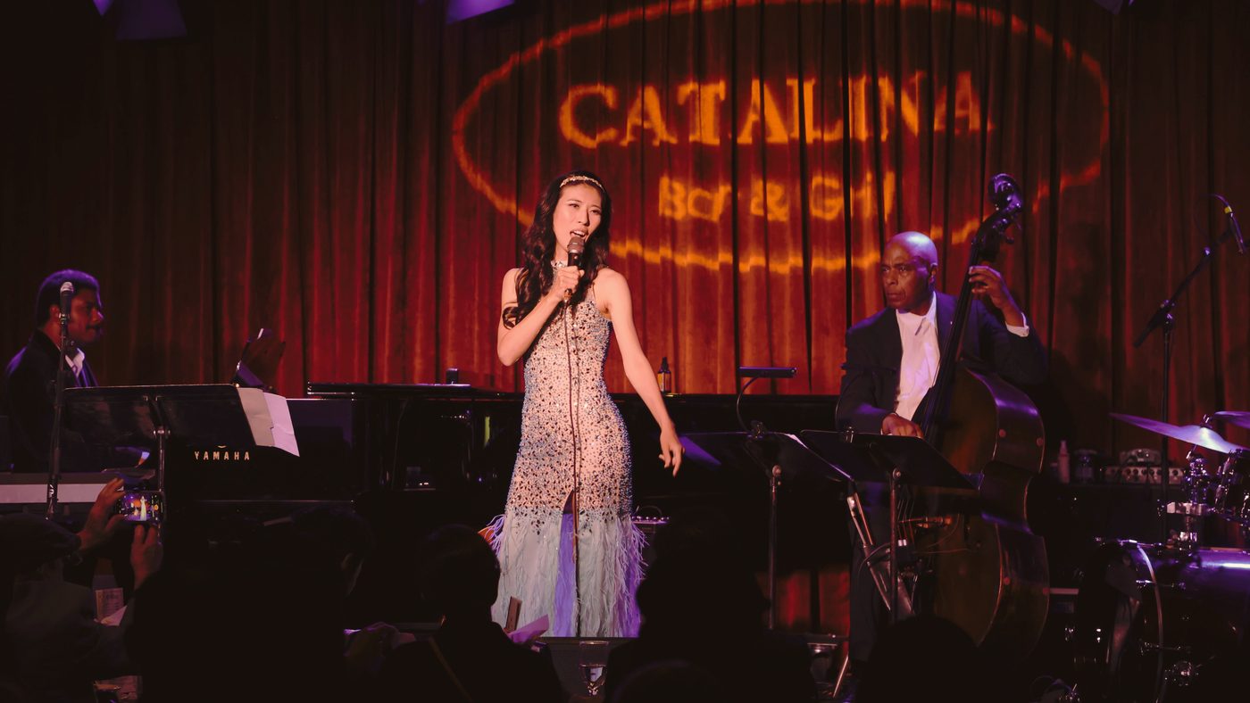 Setsuko Hata singing with her band