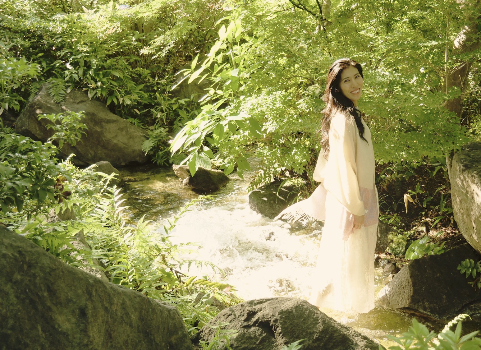Setsuko Hata beside a mountain stream